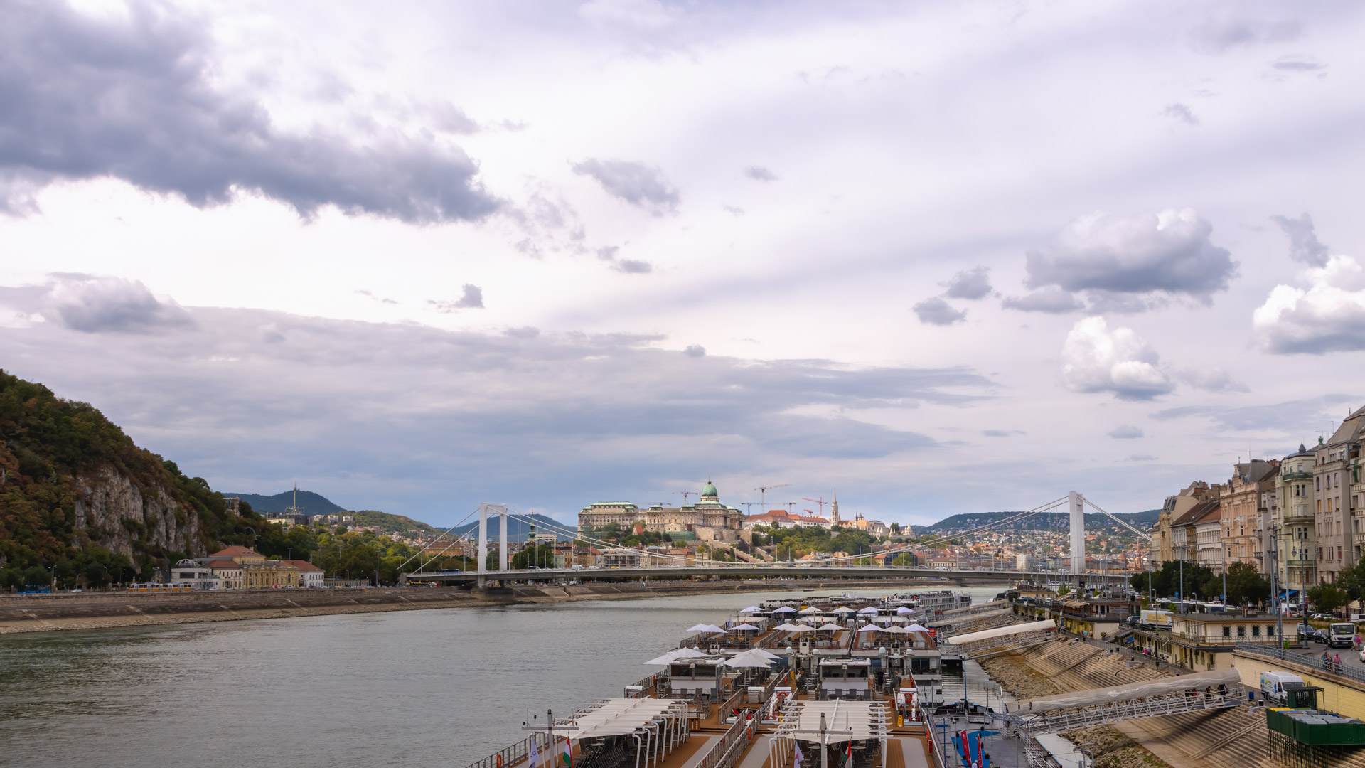 Download this stunning Budapest cityscape wallpaper in high definition (HD) for your desktop or mobile device. This wallpaper features the beautiful architecture and scenery of Budapest, including the famous Chain Bridge and Parliament building.