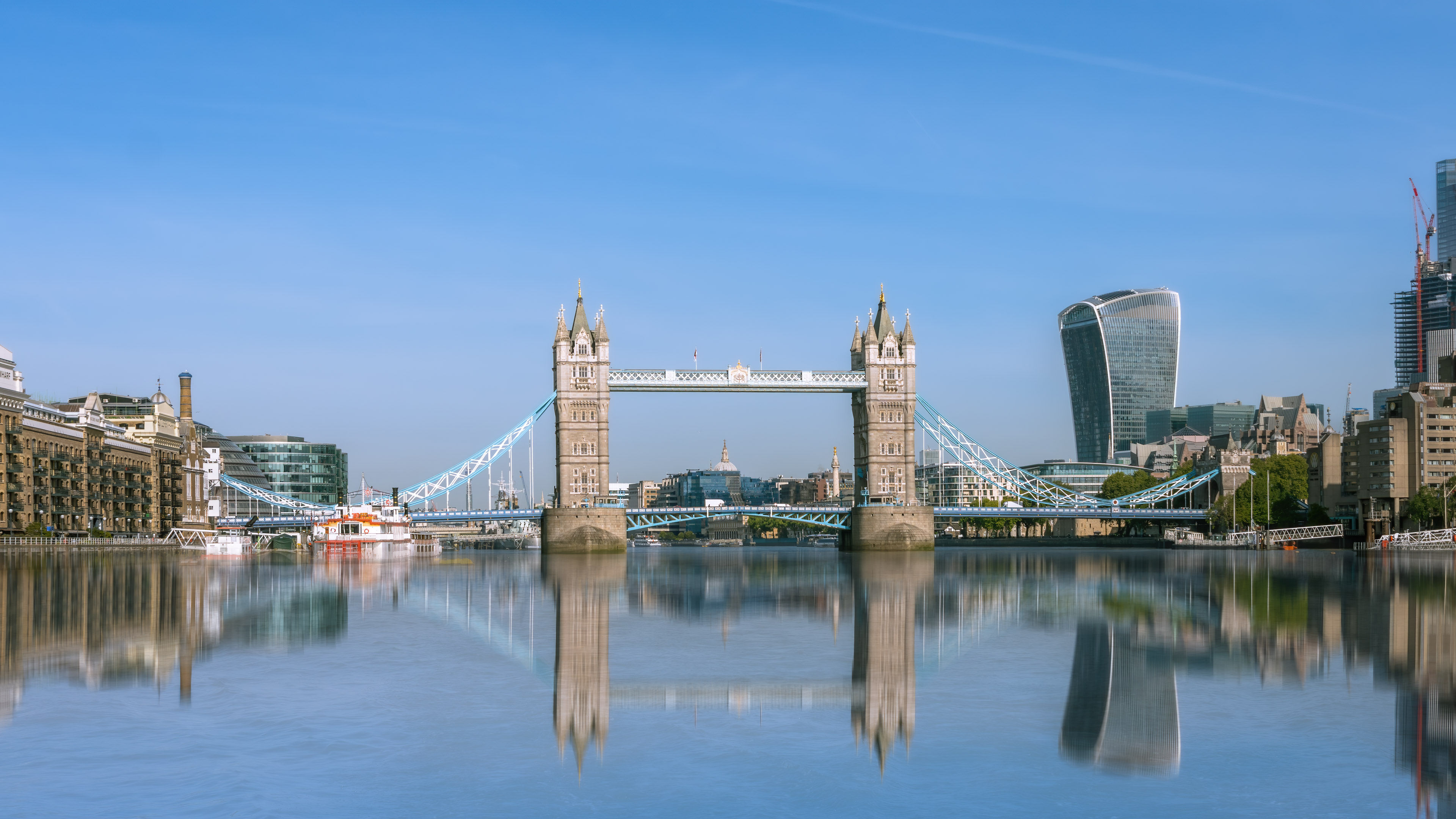 Immerse yourself in the allure of London with our London 4K city wallpaper, offering a captivating view of the Tower Bridge and the meandering River Thames.