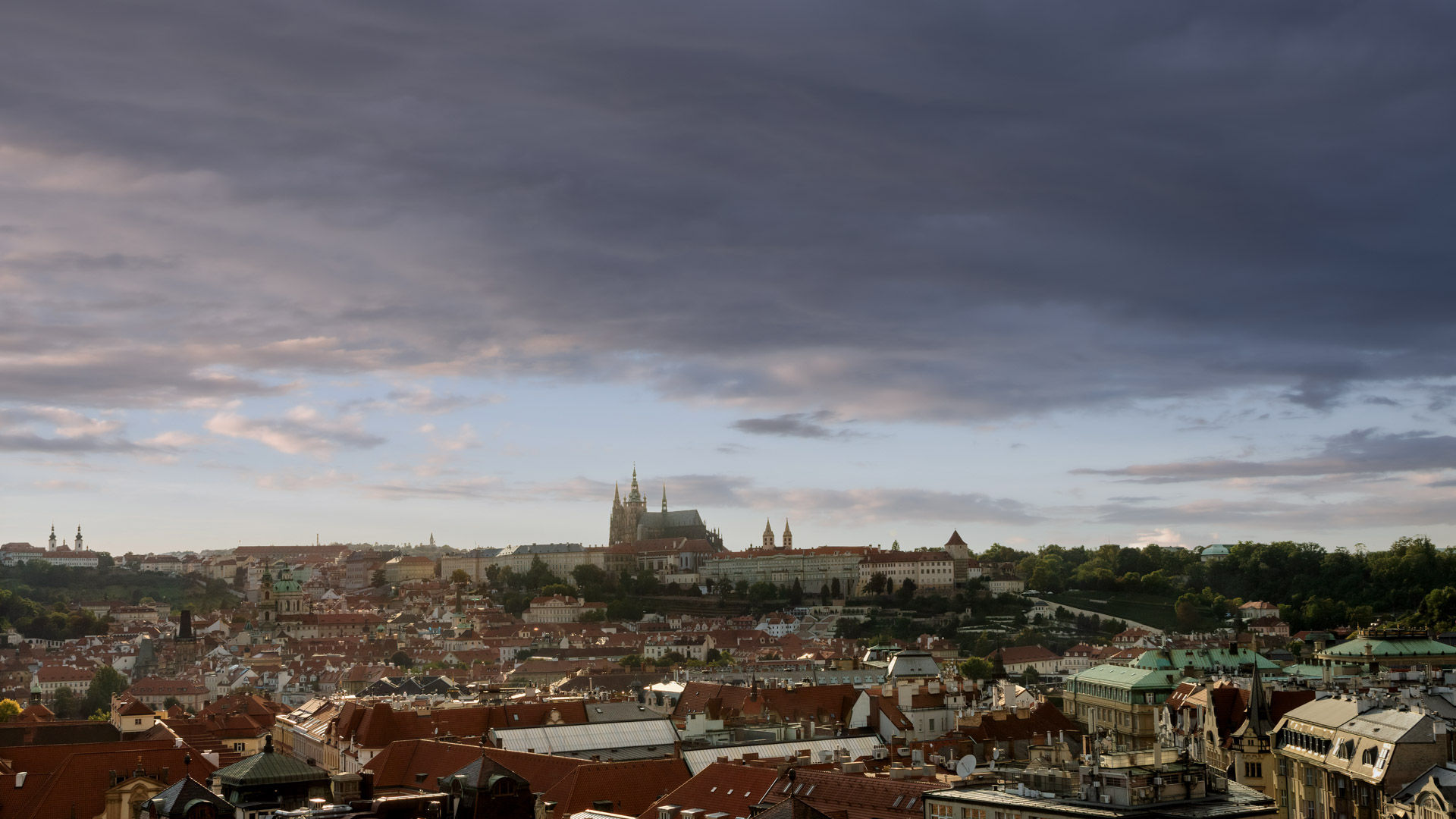 Dive into the stunning cityscape of Prague in high definition, adorning your screen with its unique charm.