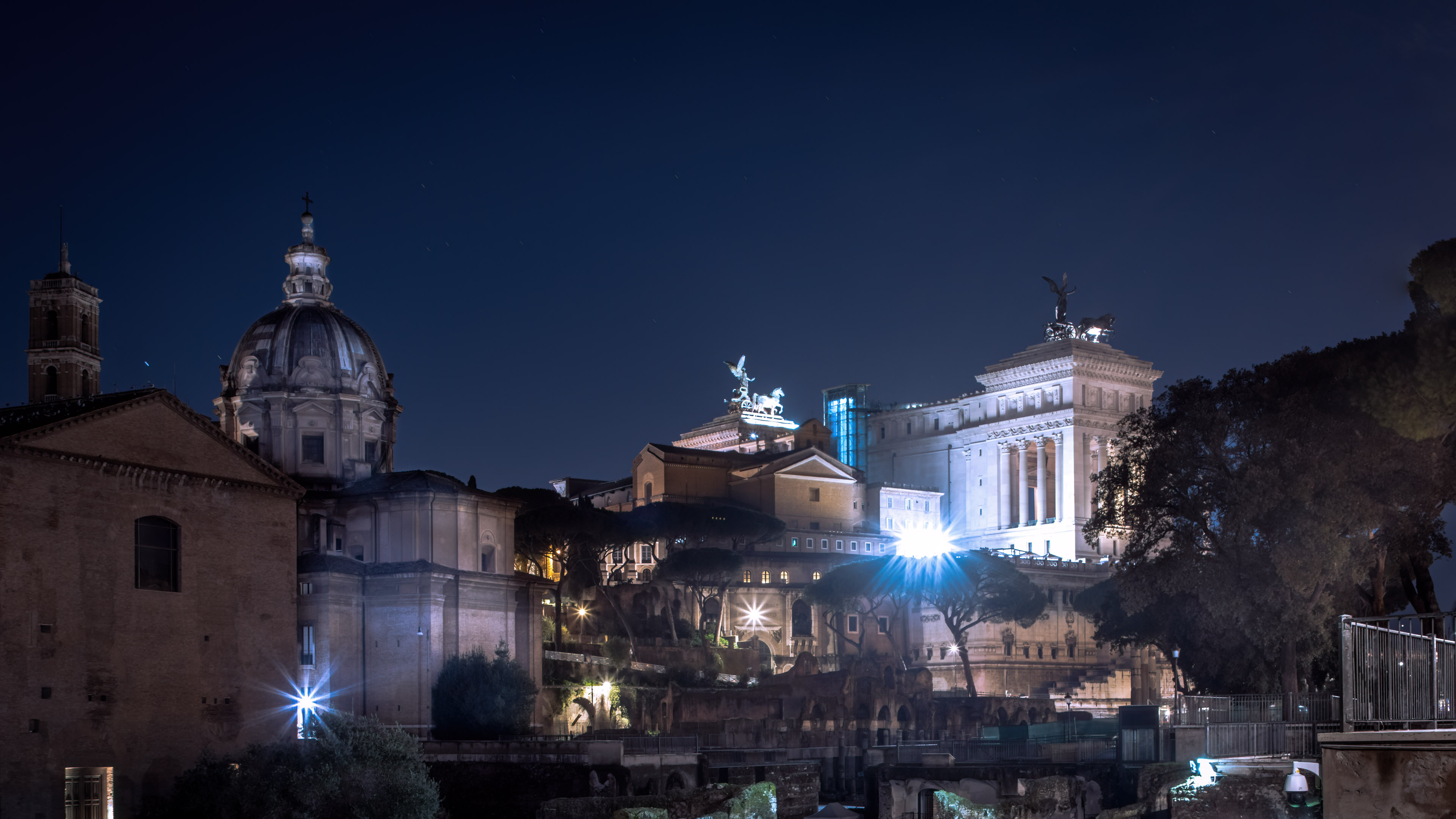 Experience the magic of Rome at night with our stunning cityscape wallpaper.