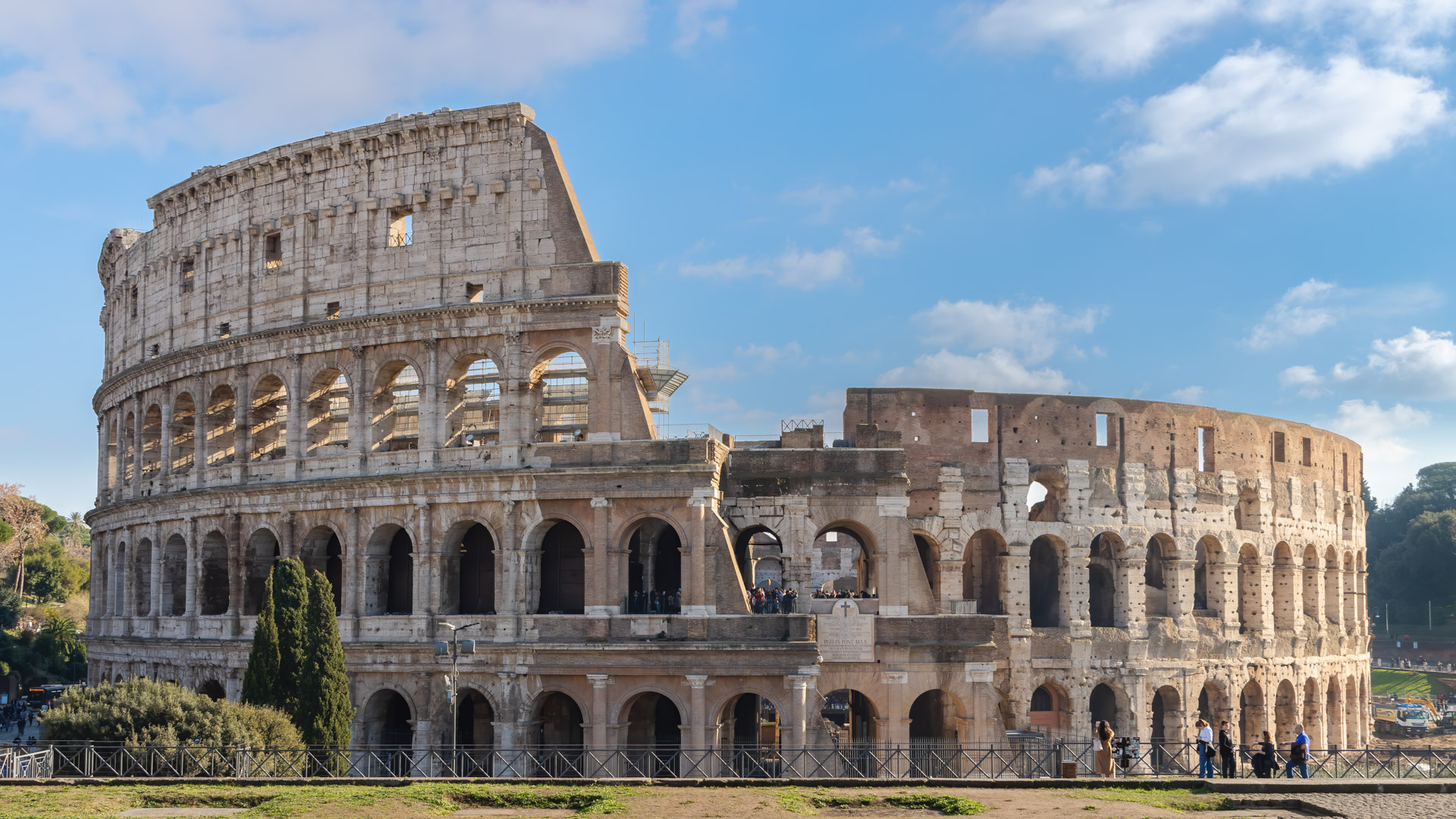 Step into the historic allure of Rome with our Colosseum Charm City Wallpaper, showcasing iconic landmarks.