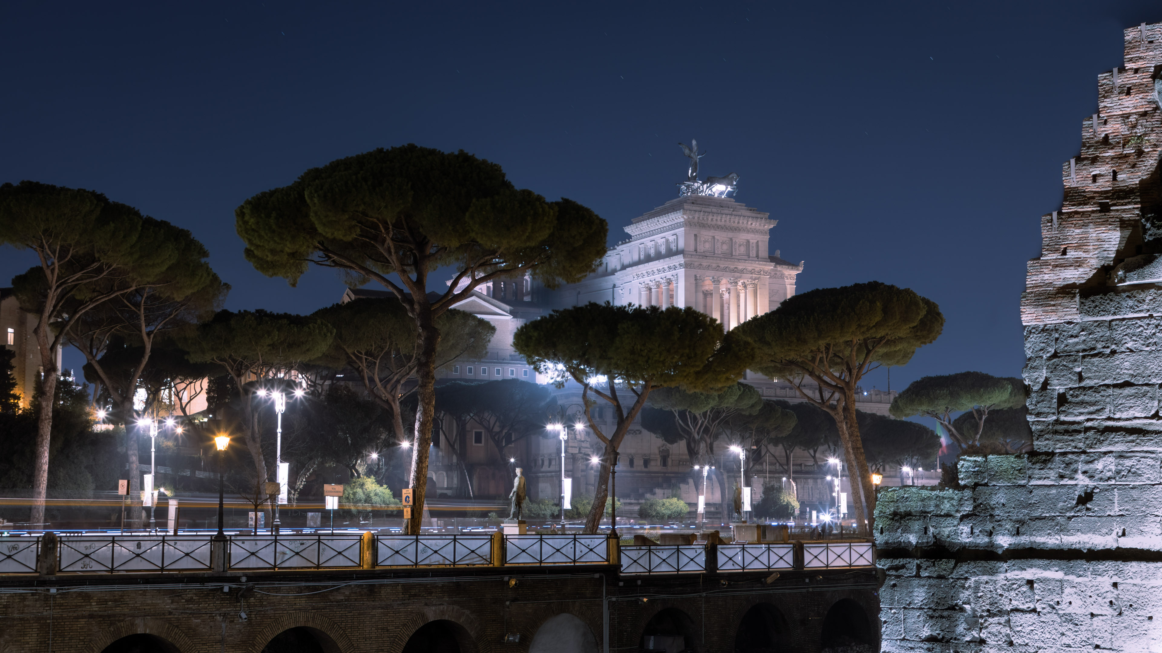 Get the best night scenery wallpaper with stunning view of Rome city at night with streetlights for your desktop.