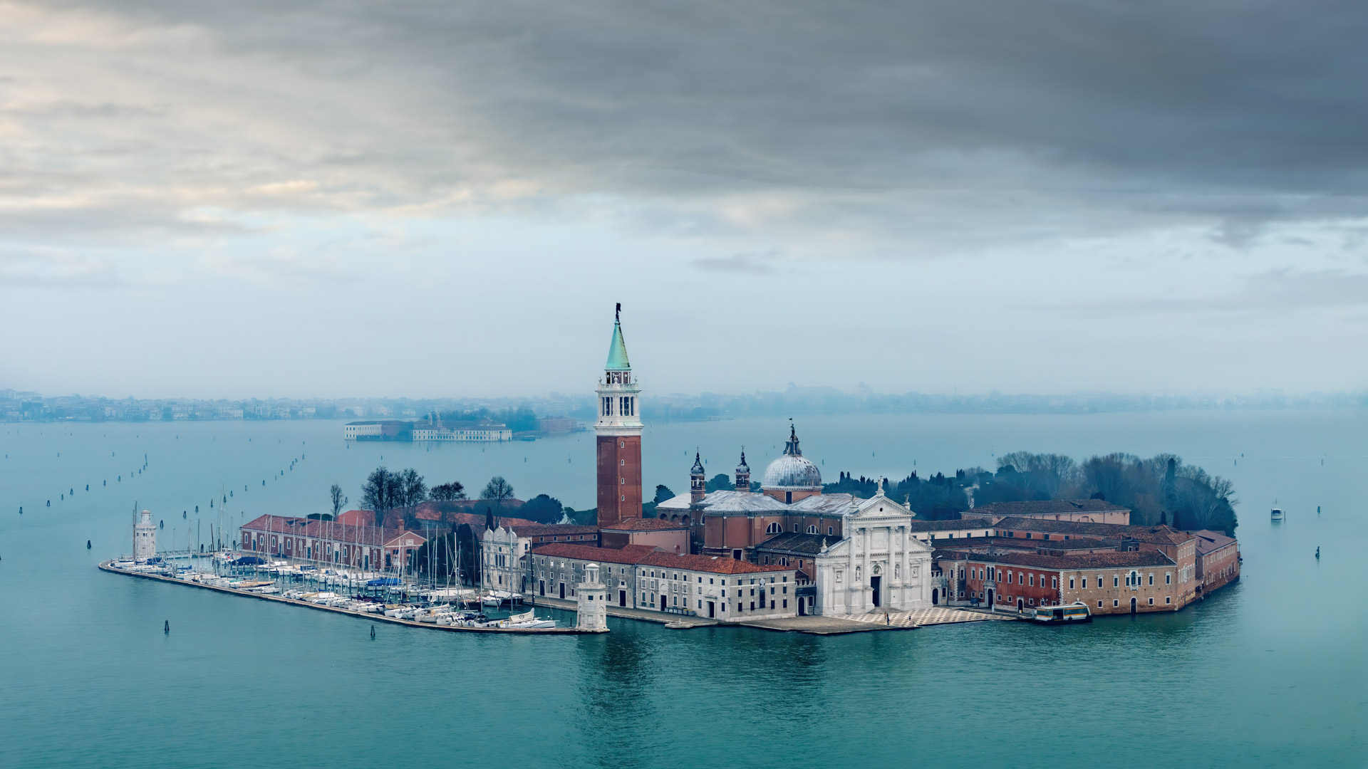 Immerse yourself in the charm of Venice with our wallpaper featuring the iconic canals, gondolas, and islands.