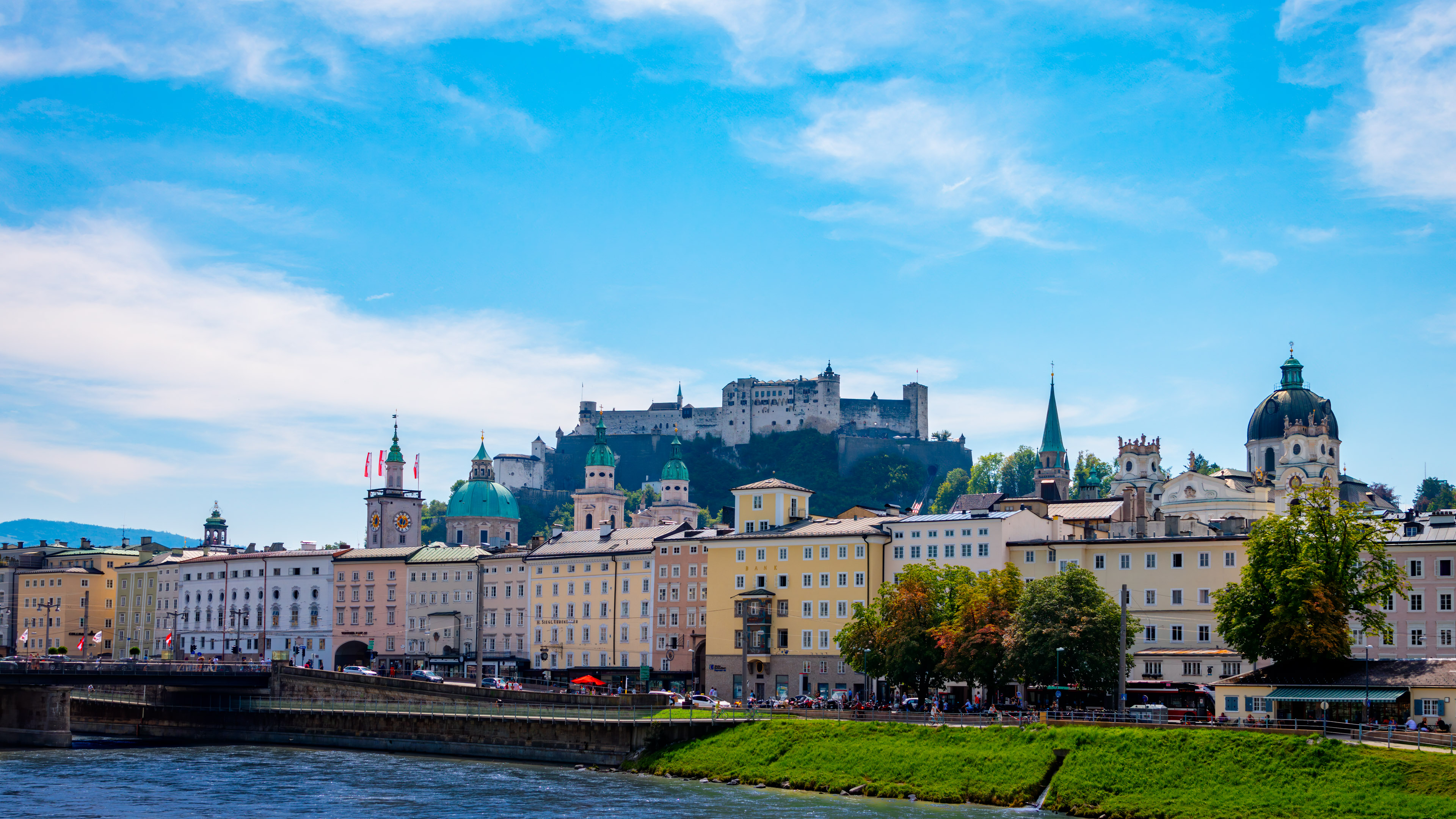 Immerse yourself in the picturesque beauty of Salzburg with our enchanting city view wallpaper, bringing Austrian charm to your device.