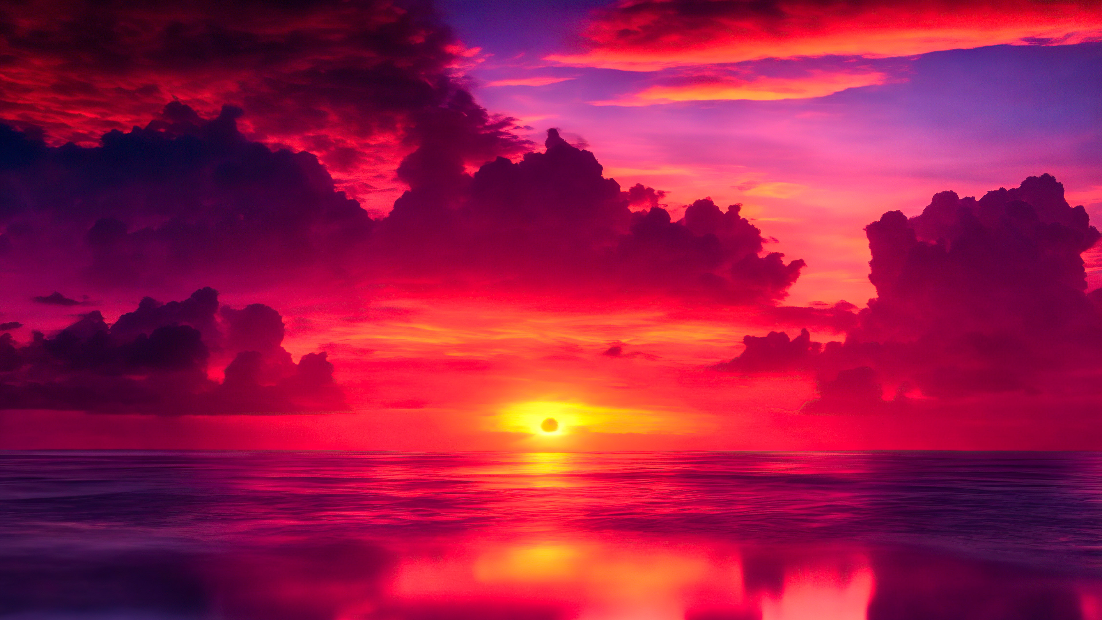 Laissez-vous captiver par un coucher de soleil hypnotisant sur un océan expansif, avec des teintes ardentes d'orange et de rose, dans notre collection de fonds d'écran de paysage en 4K pour votre PC.