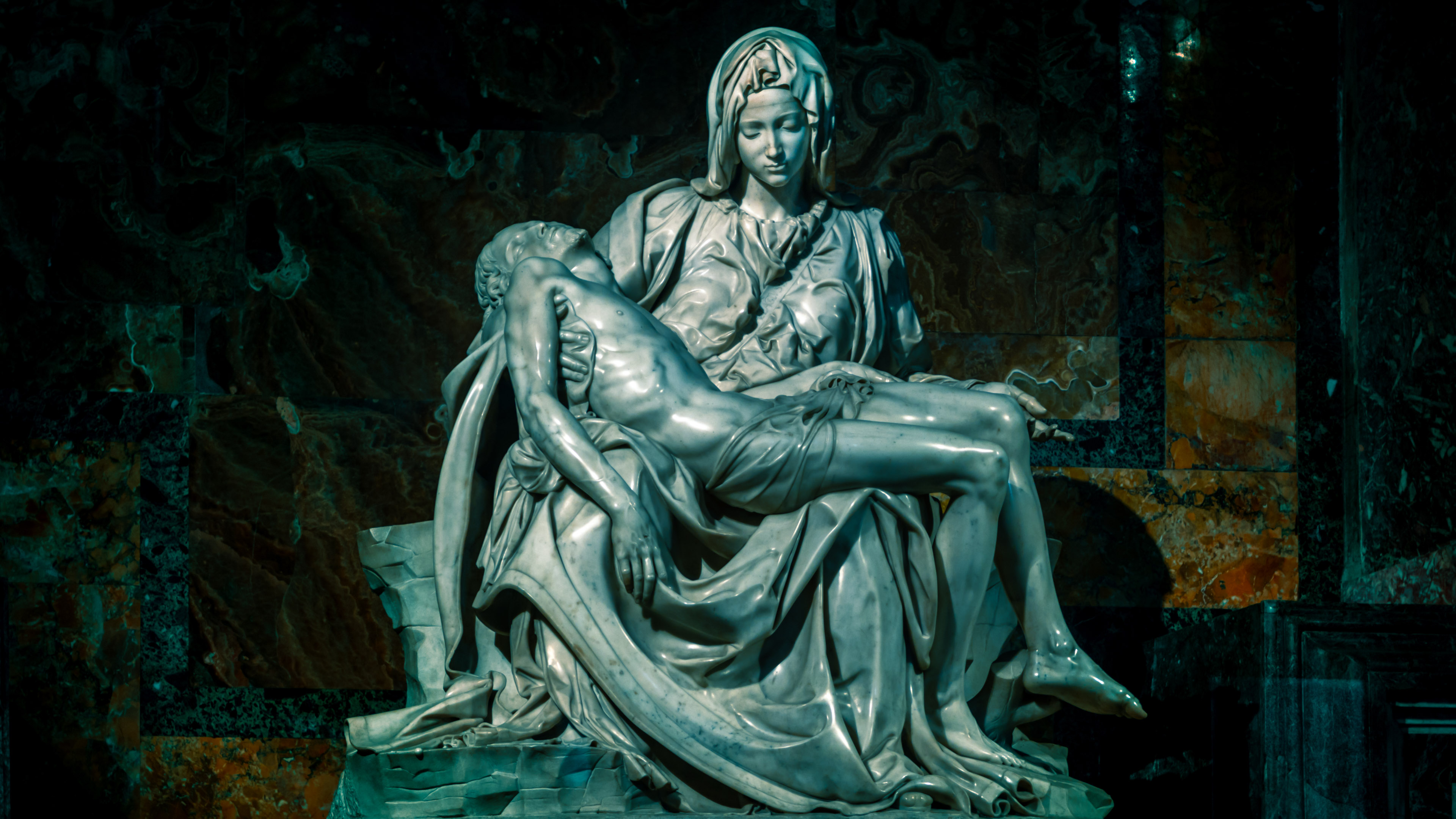 Adorn your Macbook with the divine beauty of Michelangelo's Pieta sculpture in high resolution.