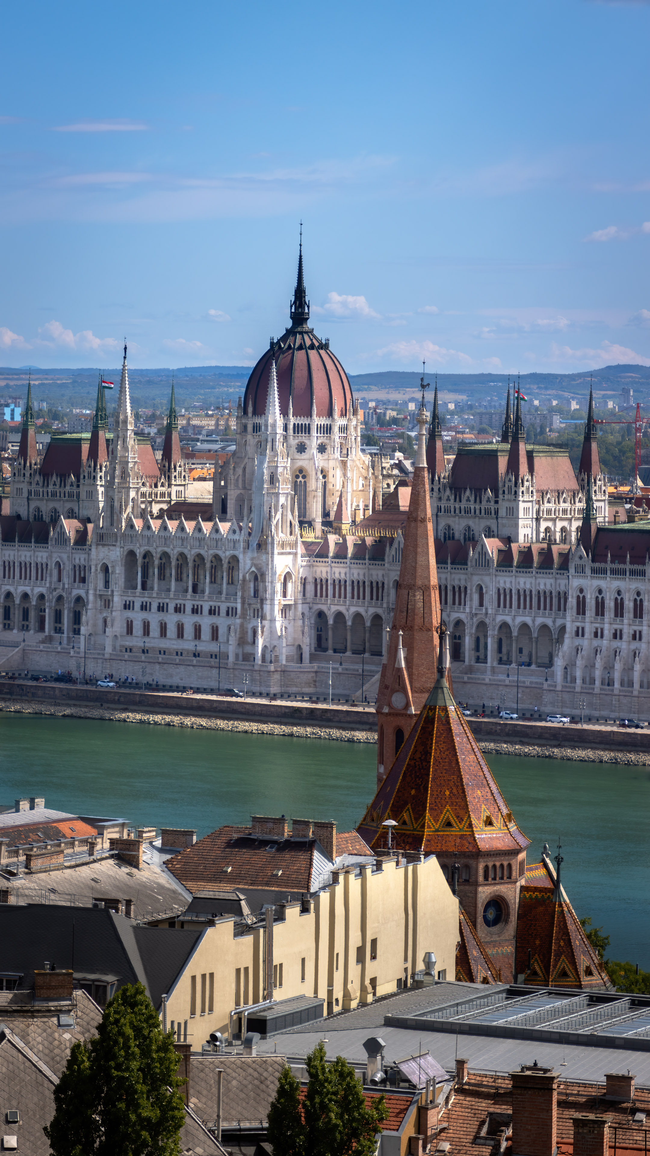 Capture the grandeur and elegance of Budapest's Parliament building with this stunning cityscape wallpaper. Featuring the iconic structure set against a beautiful blue sky, this wallpaper is perfect for adding a touch of sophistication to your screen.