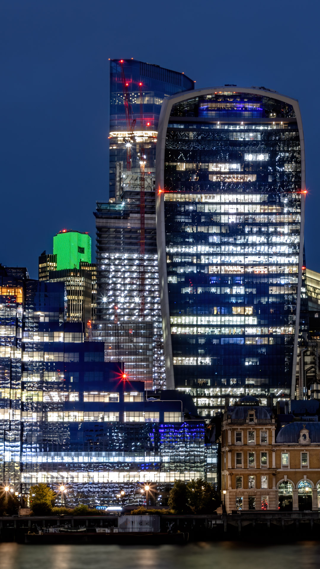 This wallpaper showcases the mesmerizing lights of the city of London at night, perfect for any iPhone user.