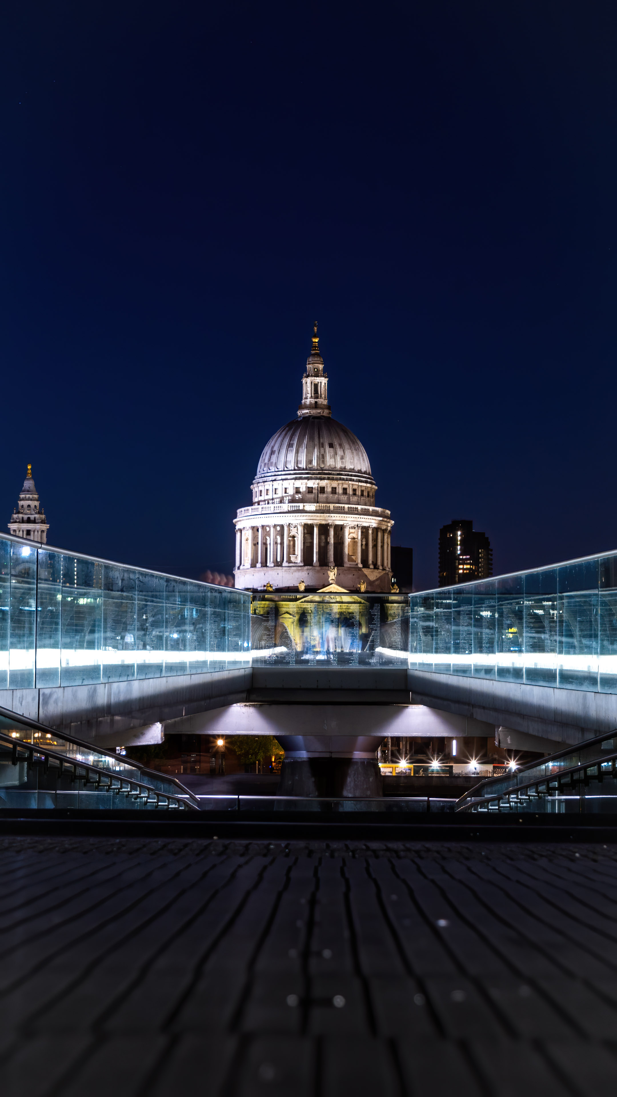 This mobile wallpaper features the vibrant and colorful night lights of London's St. Pauls Cathedral