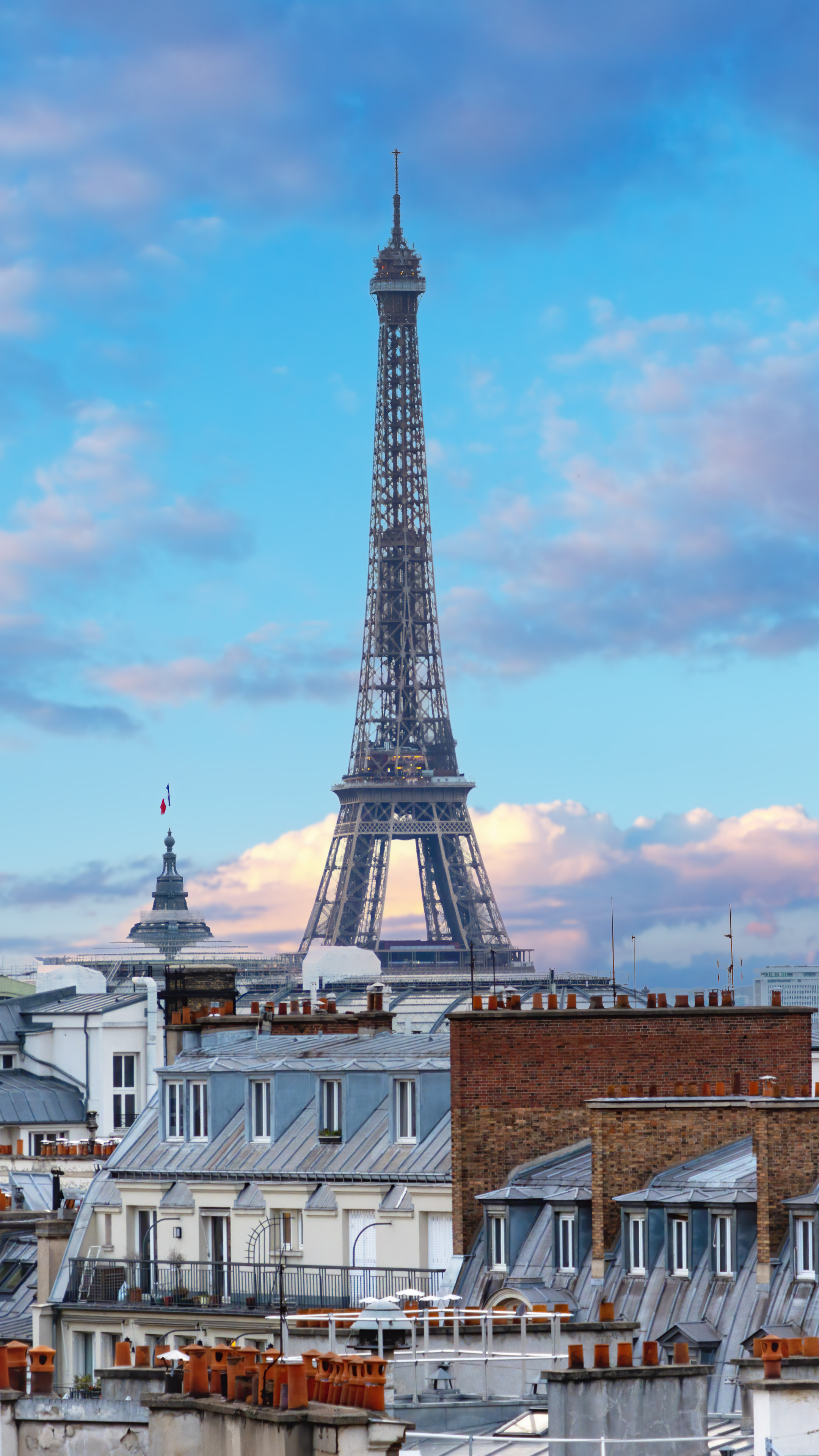 Experience the charm of Paris with this beautiful cityscape wallpaper. Featuring the Eiffel Tower.