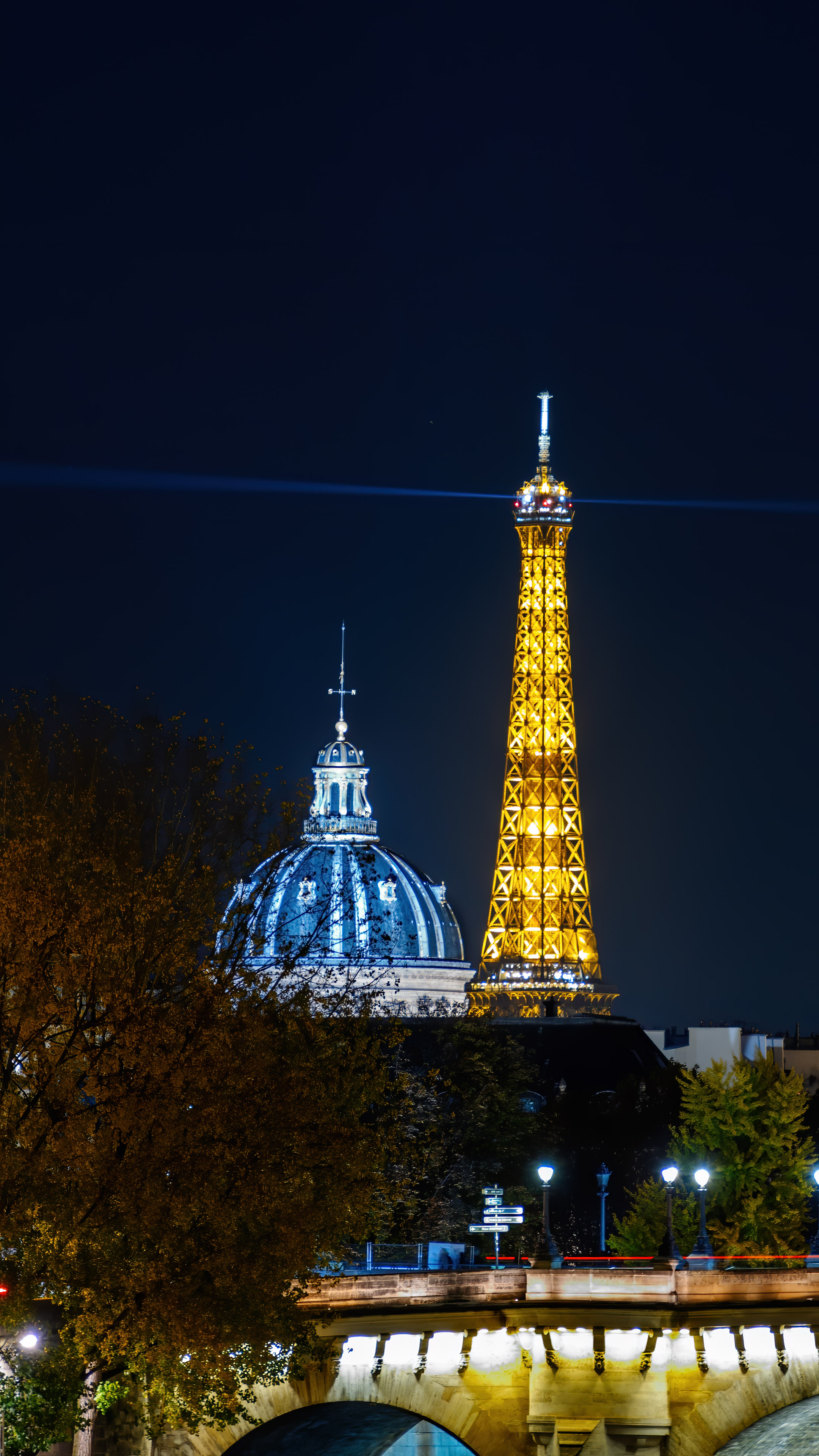 Capture the magic of Paris at night with our stunning Eiffel Tower wallpaper. Perfect for desktop and mobile devices.