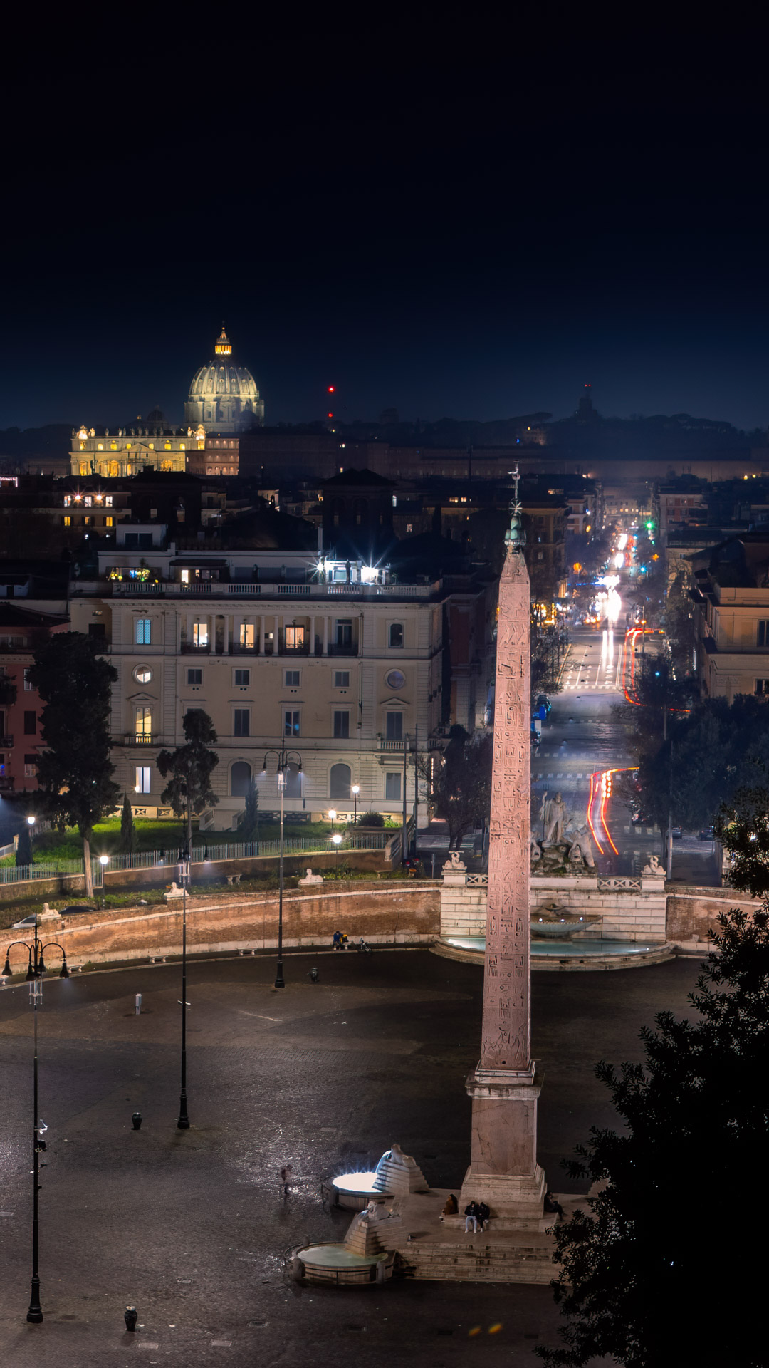 Embrace the beauty of Rome's city lights with this amazing nighttime wallpaper