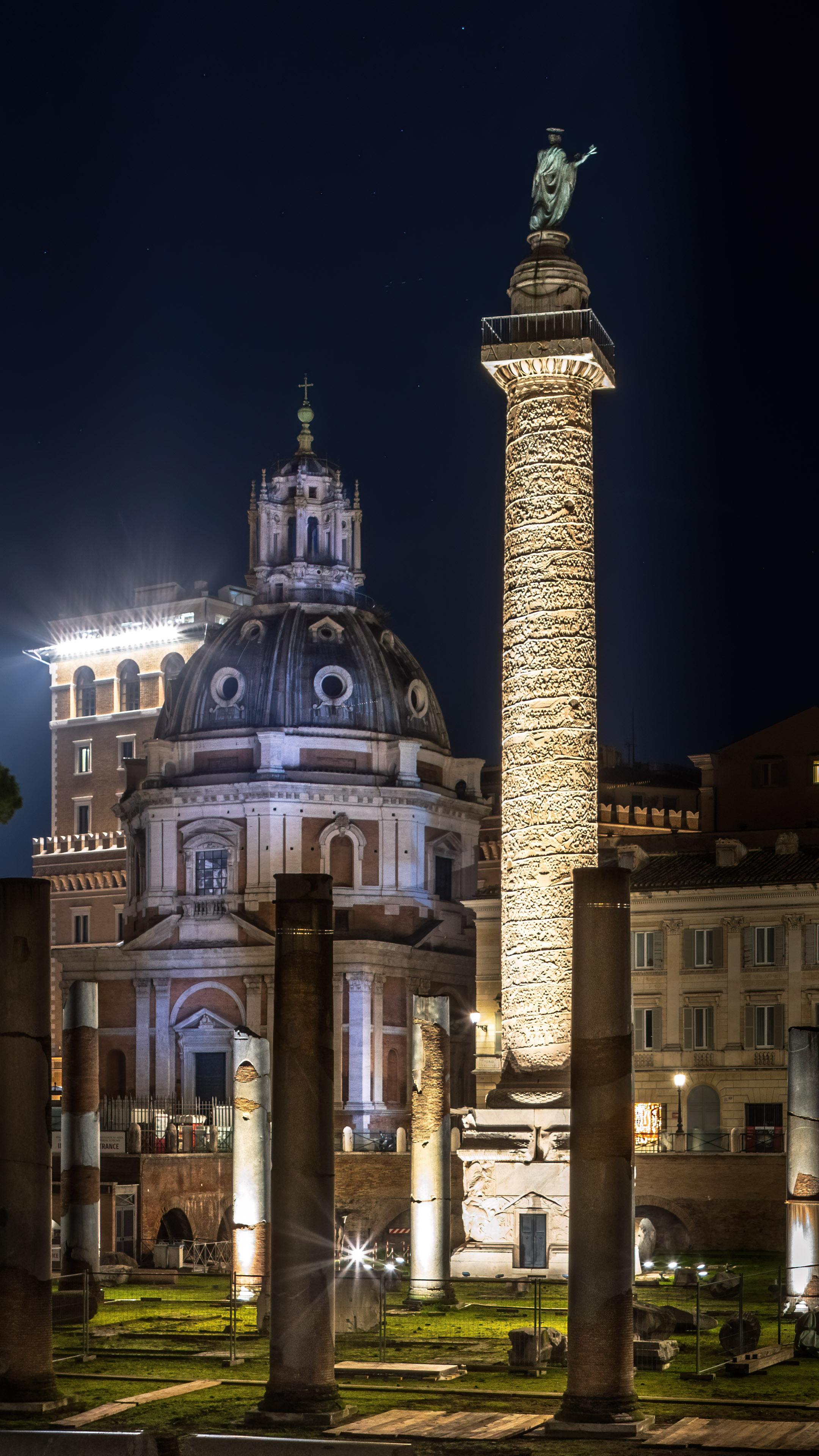 Download captivating urban wallpaper of Rome city at night with modern and historic architecture.