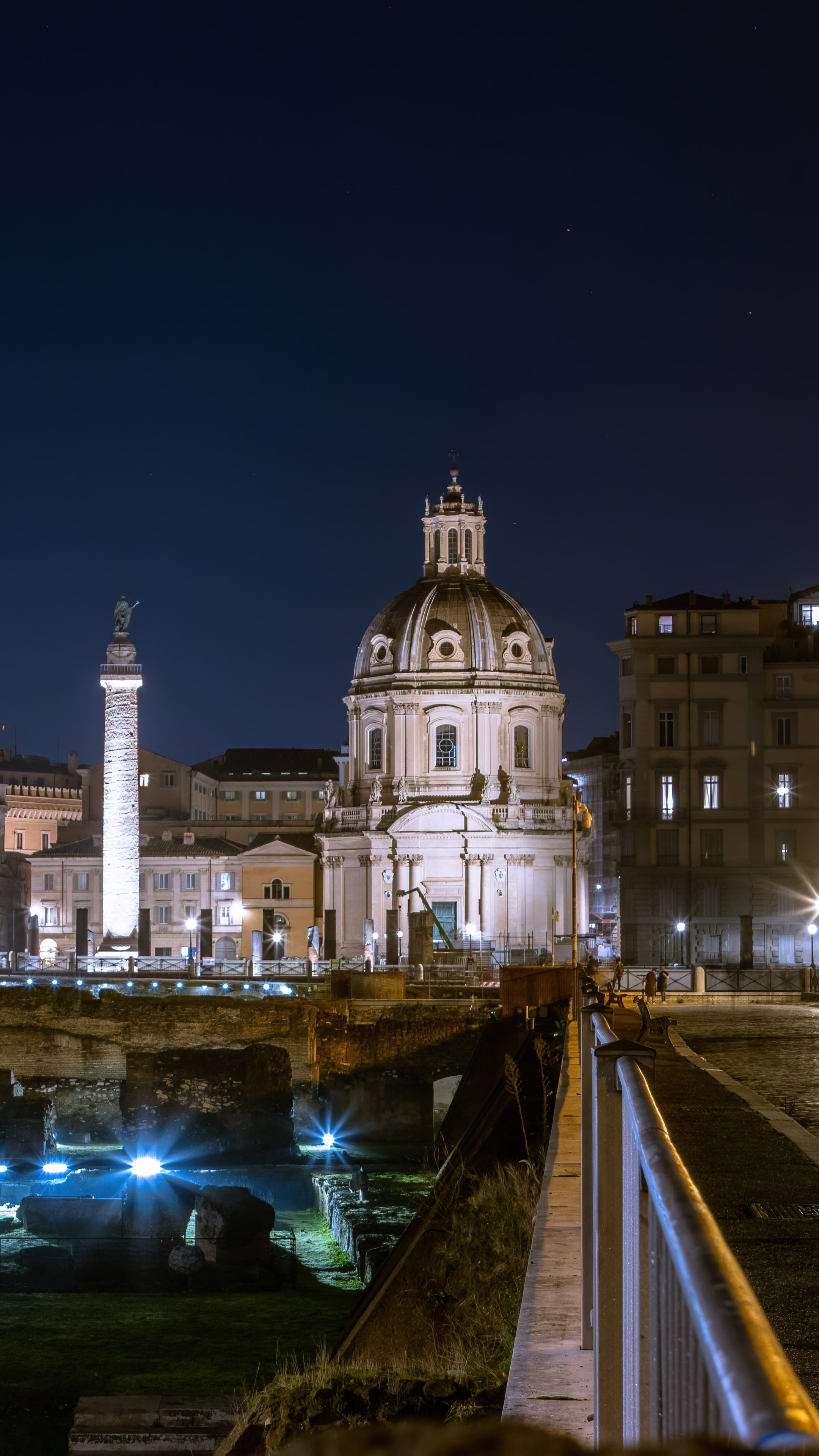 Capture the beauty of Rome's architecture at night with this stunning wallpaper