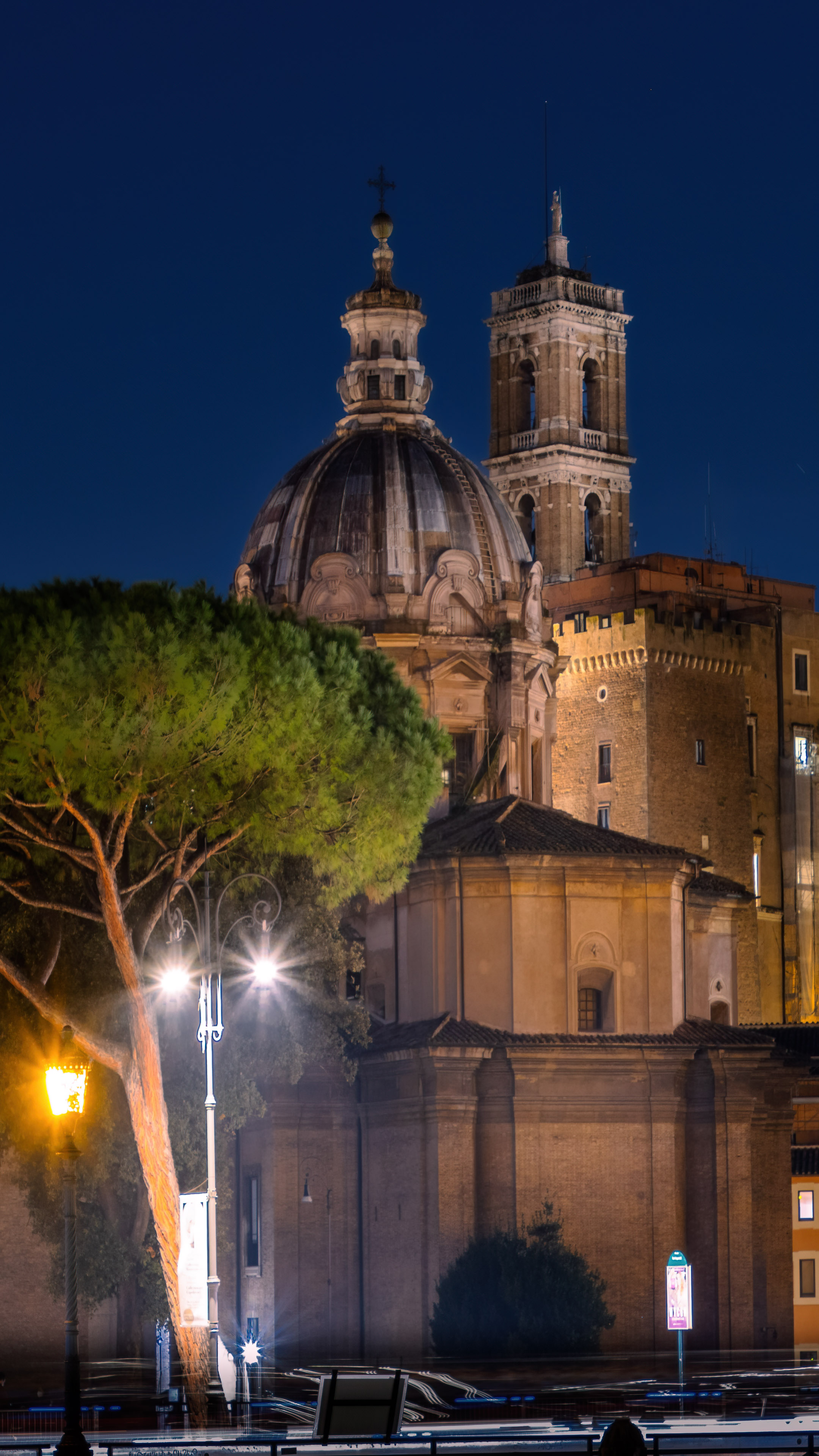 Experience the wonder of Rome's iconic landmarks at night with this stunning wallpaper.