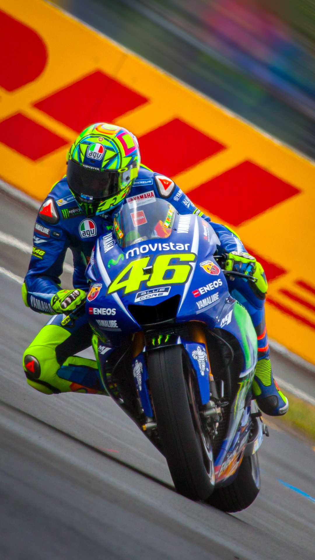 Experience the thrill of motor racing with our best iPhone wallpaper featuring Valentino Rossi, adding a touch of adrenaline to your device.
