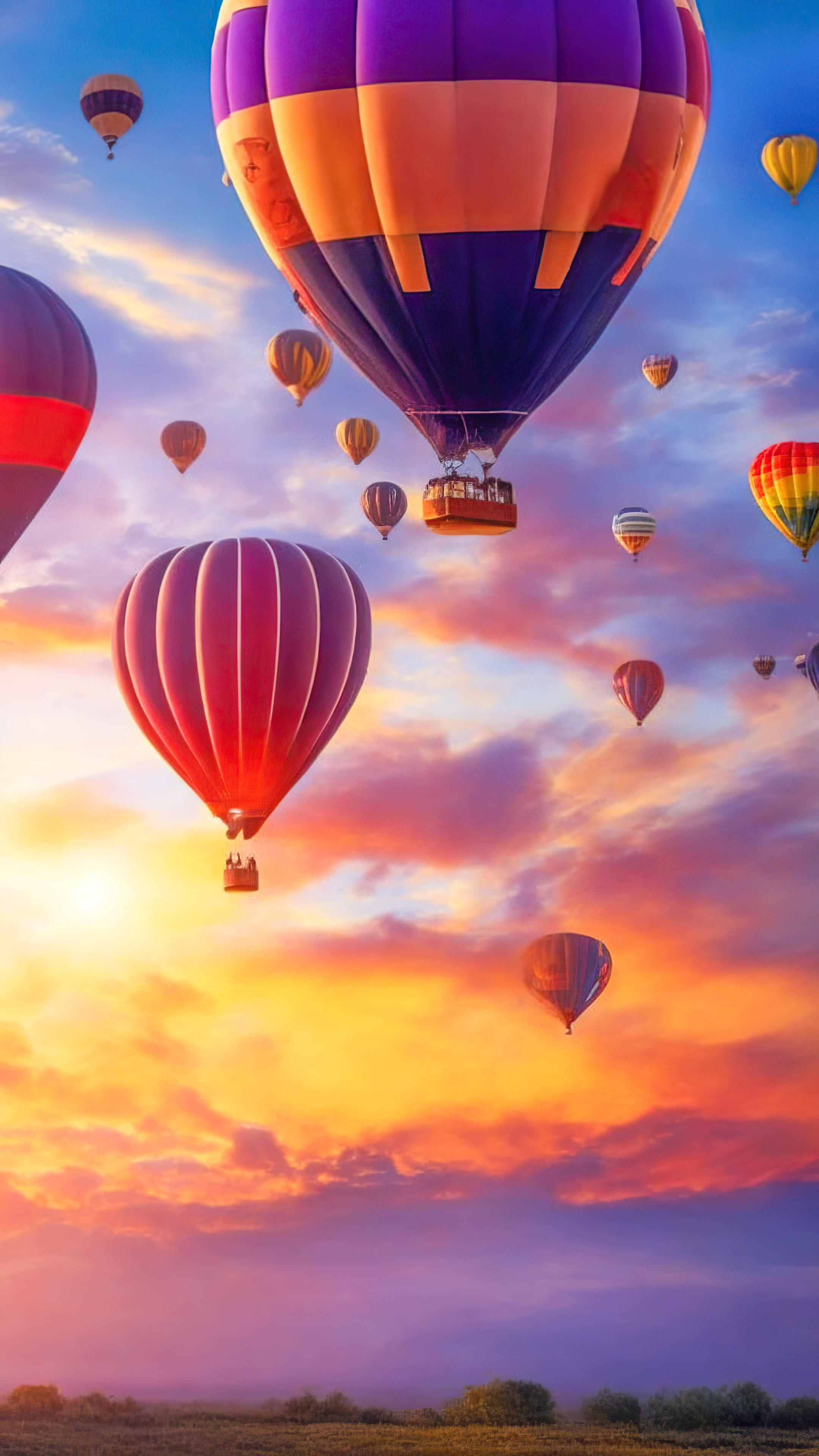 Get lost in the magic of a whimsical and dreamy sky filled with floating, colorful hot air balloons at sunrise, with clouds and sky background.