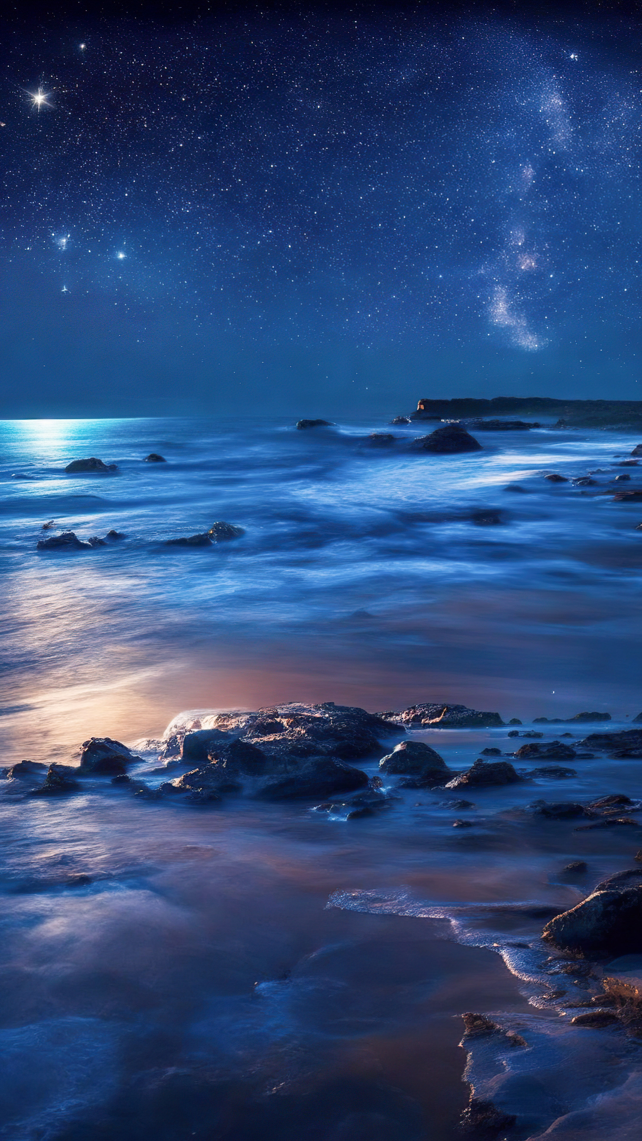 Experience the serenity of our oceanic night wallpaper, showcasing a secluded beach at night where waves caress the shore beneath a blanket of shimmering stars.